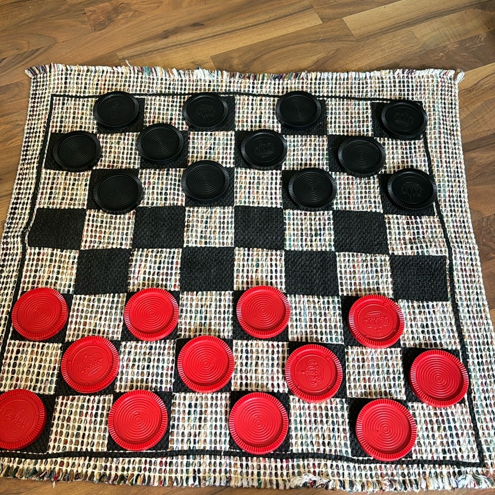Fun double sided game.   Checkers on one side tic tac toe on the other.